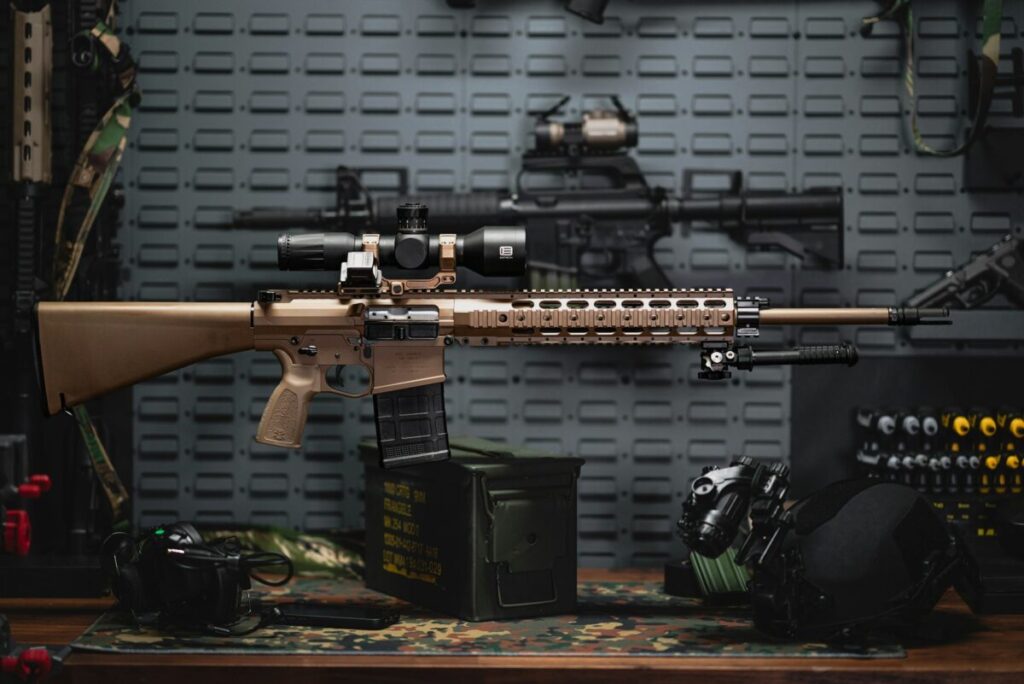 Rifle on a table next to other items
