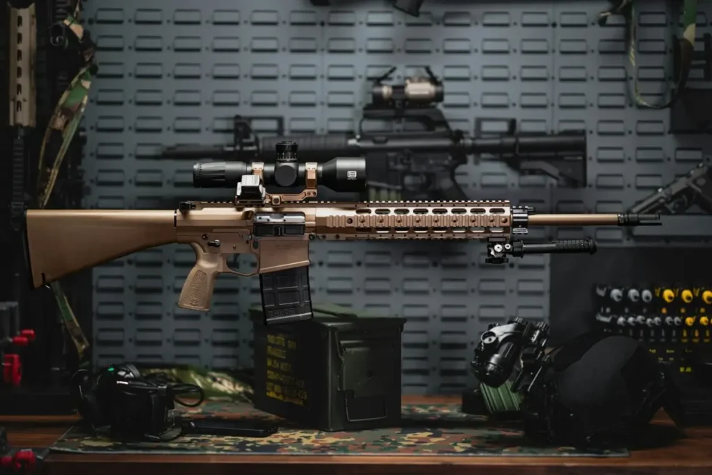 Rifle on a table next to other items