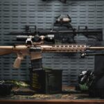 Rifle on a table next to other items